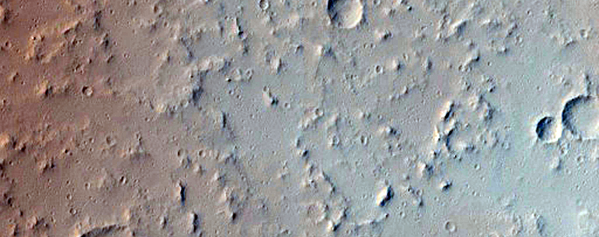 Lava Flow and Impact Crater East of Tharsis Tholus