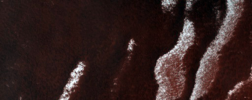 Persistent Northern Plains Ice Deposit Leeward of Crater
