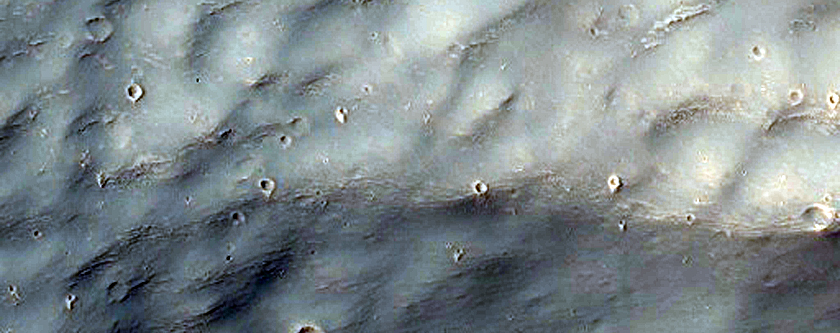 Layers Exposed in Crater in Terra Sirenum