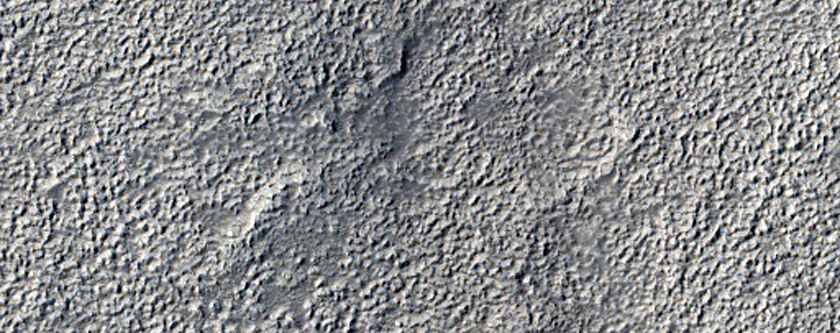 Tilted Layers on Edge of Northern Mid-Latitude Crater