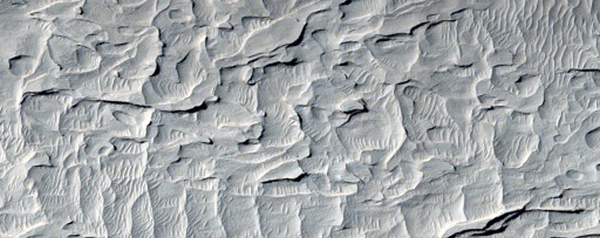 Distal Alluvial Fan Slopes and Sand in the Medusae Fossae Formation