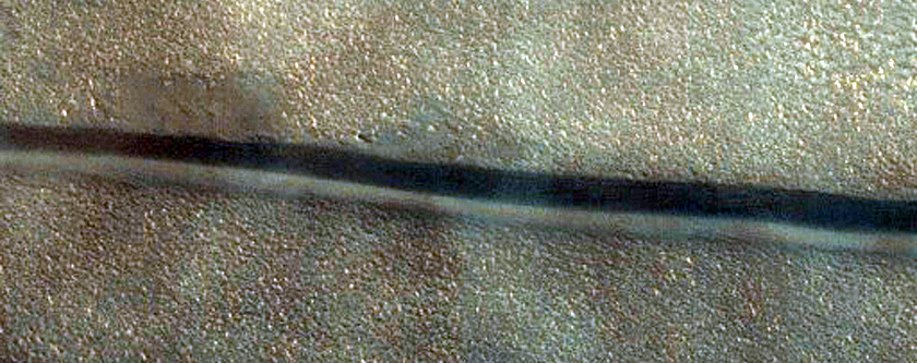 Avfrostande flckar och sanddyner i Chasma Boreale