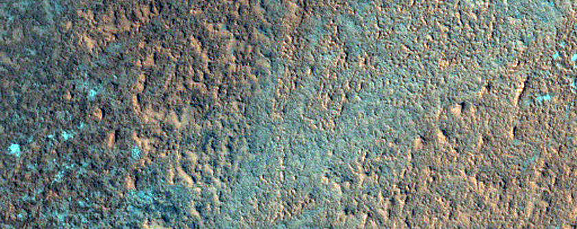 Crater Ejecta Emerging From Beneath Edge of North Polar Layered Deposits