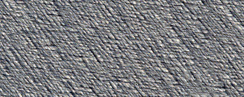 Deposits in Partially Exhumed Crater at Edge of Medusae Fossae Formation