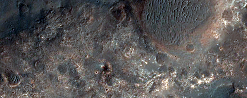 Contact between Clays and Dark Deposits along Coprates Region Plateau