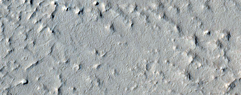 Layered Terrain and Crater Ejecta Deposits in Arabia Terra