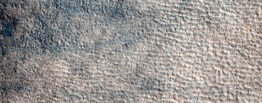 Small Northern Mid-Latitude Crater Surrounded by Wind Streaks