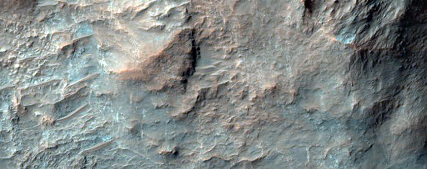 Well-Exposed Layered Bedrock on Crater Floor in Terra Sabaea