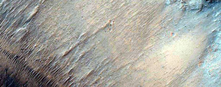Crater with Fractured Floor North of Ganges Chasma