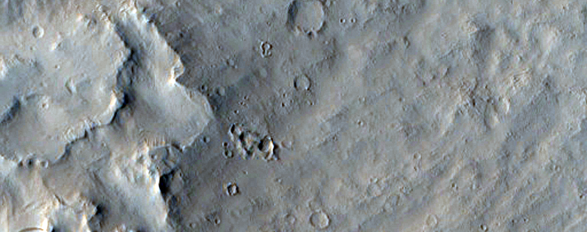 Layers in Pedestal Crater Near Eumenides Dorsum