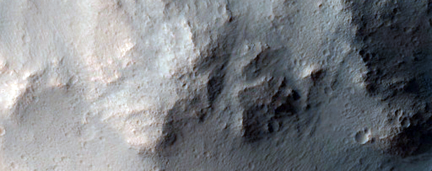 Well-Preserved Impact Crater on Floor of Larger Infilled Crater