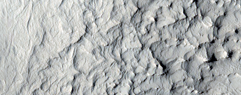 Layered Terrain and Crater Ejecta Deposits in Arabia Terra