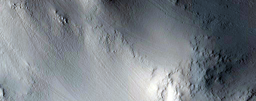 Layers in Crater West of Tikhonravov Crater