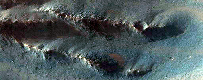 Light-Toned Layered Deposits along Coprates Chasma Wallrock
