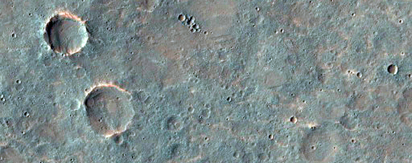 Distorted Transverse Aeolian Ridges in Small Craters in Sinai Planum