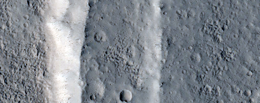 Valley and Flows on Alba Mons