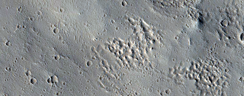 Flows in Contact with Northeast Lycus Sulci Terrain