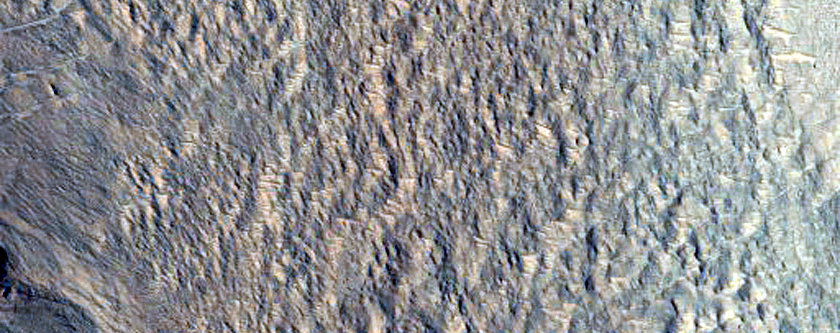 External Ponded and Pitted Materials Off Western Rim of Mojave Crater