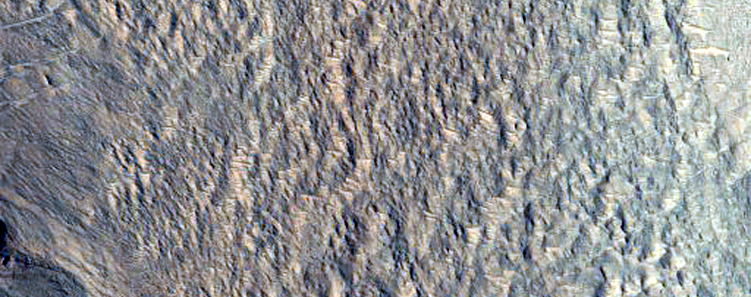 External Ponded and Pitted Materials Off Western Rim of Mojave Crater