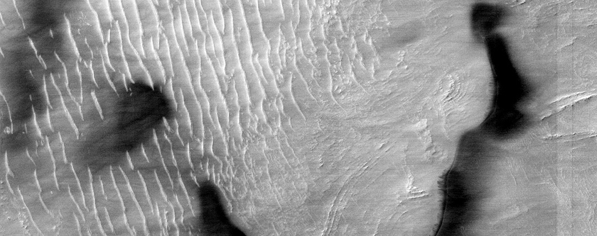 Depression in Hellas Planitia with Dark Spots