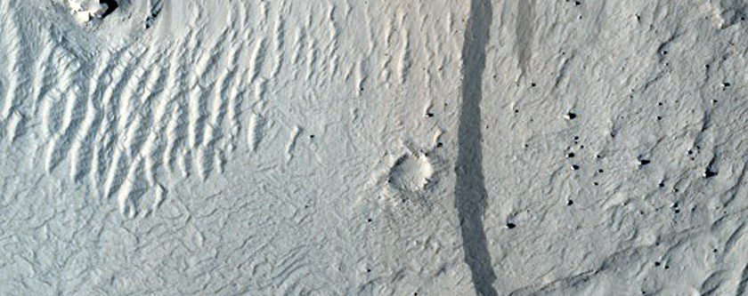 Layers in Pedestal Crater in Tikhonravov Crater