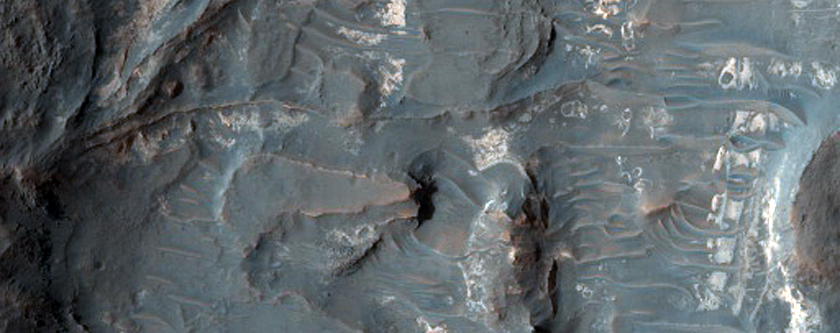 Light-Toned Deposits Exposed along Floor of Terra Sabaea Crater