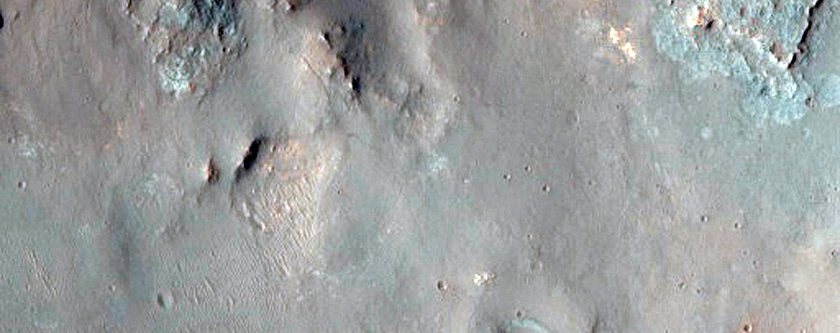 Channel and Mesa-Forming Material on West Wall of Elorza Crater