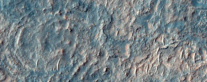 Pit Exposing Layered Bedrock