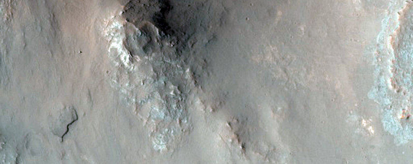 Channel and Mesa-Forming Material on West Wall of Elorza Crater