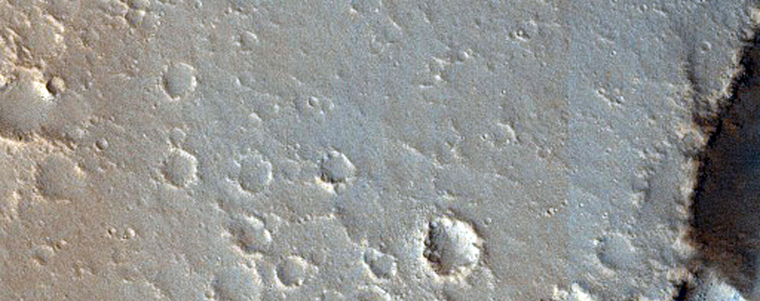 Pits and Troughs in Hephaestus Fossae