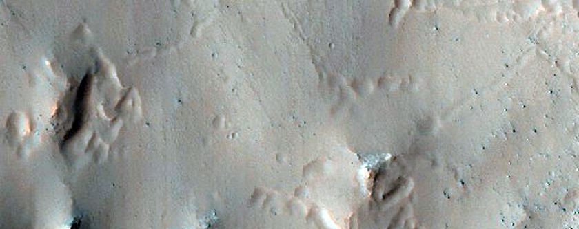 Well-Preserved 6-Kilometer Impact Crater in Aonia Terra