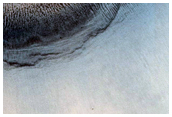Dark-Toned Pitted Mound in Crater in Northeast Arabia Terra