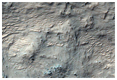 Possible Hydrated-Silica-Bearing Material in Northwest Hellas Planitia