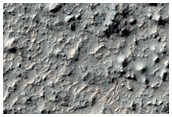 Pit on Crater Floor with Layered Material