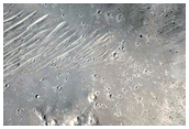 Flow-Ejecta Crater with Distinctive Pitted Central Peak