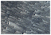 Flows and Fesenkov Crater Ejecta
