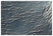 Light-Toned Mesa-Forming Materials in Terrain Cut by Samara Valles