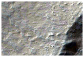 Light-Toned Deposits along Coprates Chasma Wallrock Slopes