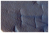 Erosion of Crater Deposits Near Milankovic Crater