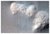 Impact Crater Exposing Bedrock