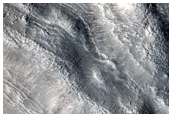 Ridges and Troughs in Crater Ejecta inside Cerulli Crater