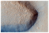Layered Features along Mesa Wall in Protonilus Mensae