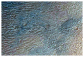 Impact Crater Exposing Bedrock