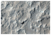 Crater in Central Arabia Terra with Yardangs at Northeast Wall