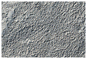 Channels along Edge of Northern Mid-Latitude Ejecta