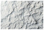 Layered Terrain and Crater Ejecta Deposits in Arabia Terra