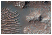 Central Pit of 38-Kilometer Crater Superimposed on Rim of Vinogradov Crater