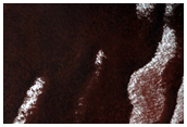 Persistent Northern Plains Ice Deposit Leeward of Crater