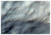 Layers Exposed in Crater in Terra Sirenum