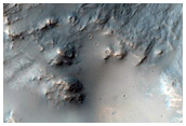 Well-Preserved Rocky 6-Kilometer Crater on Rim of Larger Crater